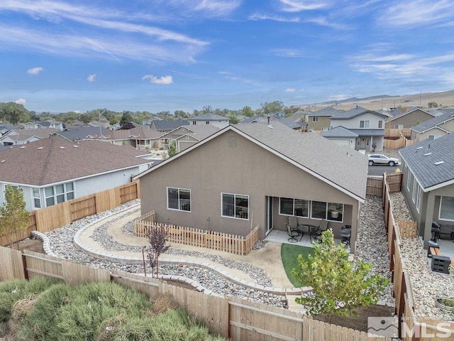 rear view of house with a patio