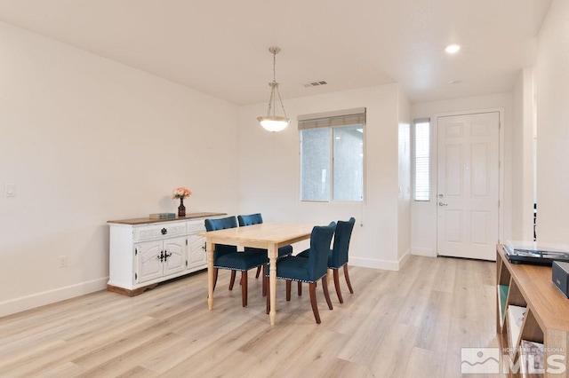 dining area with light hardwood / wood-style flooring