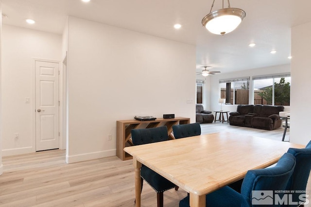 dining room with light hardwood / wood-style flooring and ceiling fan