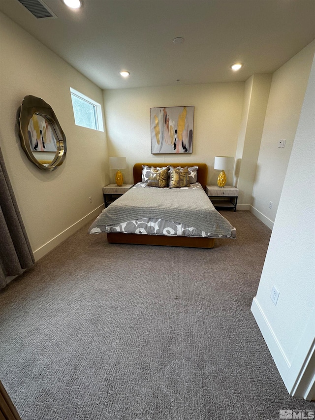 unfurnished bedroom with dark colored carpet