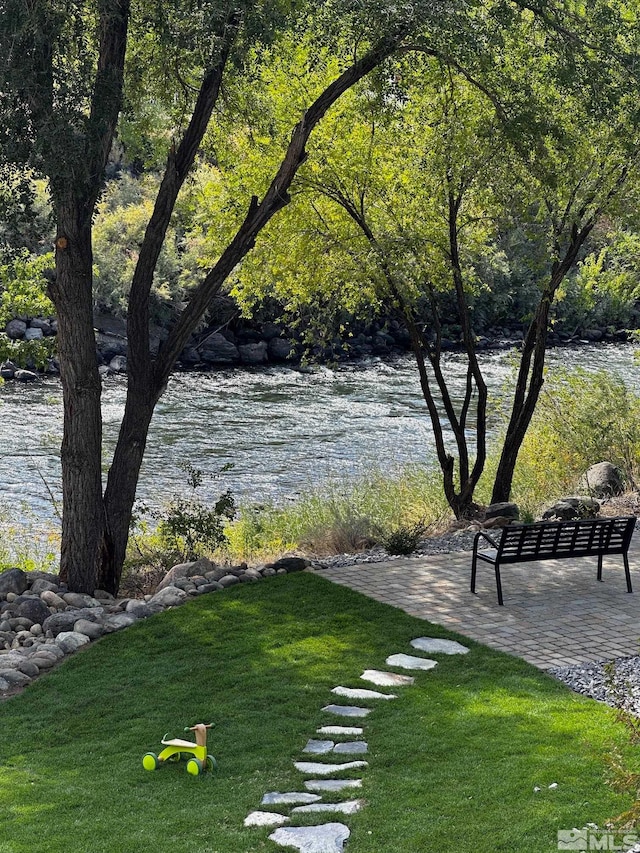 view of home's community featuring a water view