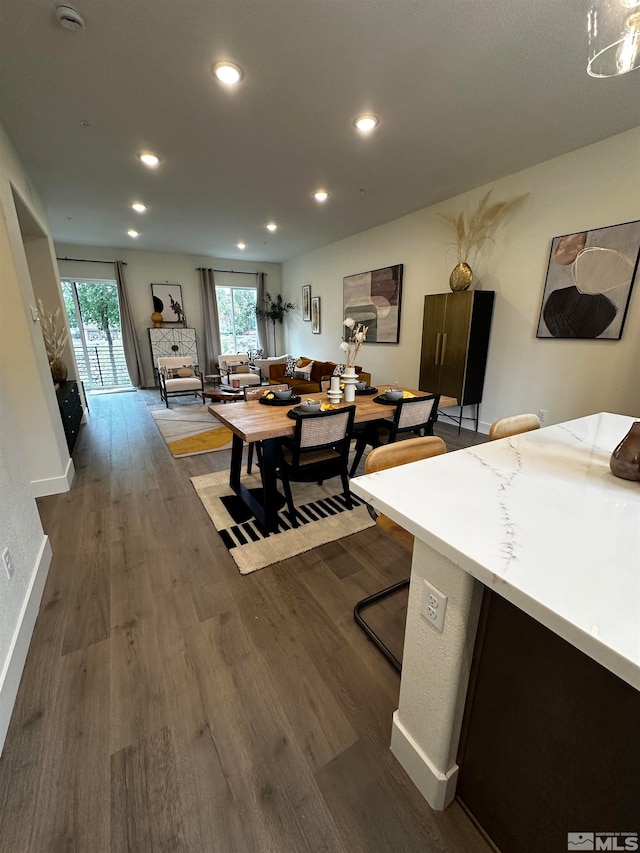 dining space featuring dark hardwood / wood-style floors