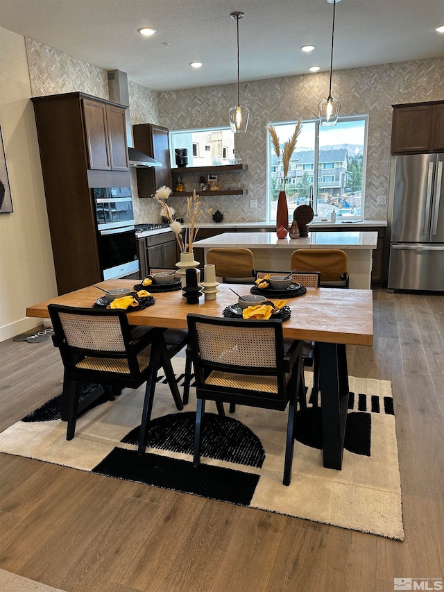 dining area with light hardwood / wood-style floors