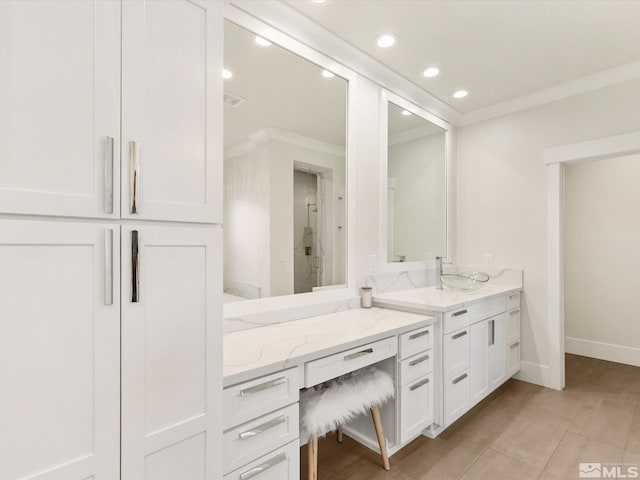 bathroom featuring walk in shower, vanity, crown molding, and tile patterned floors