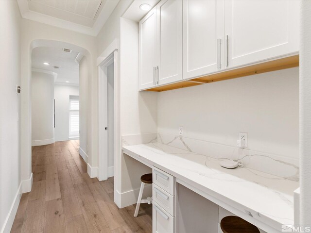 office area featuring light hardwood / wood-style flooring and ornamental molding