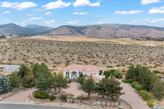 birds eye view of property featuring a mountain view