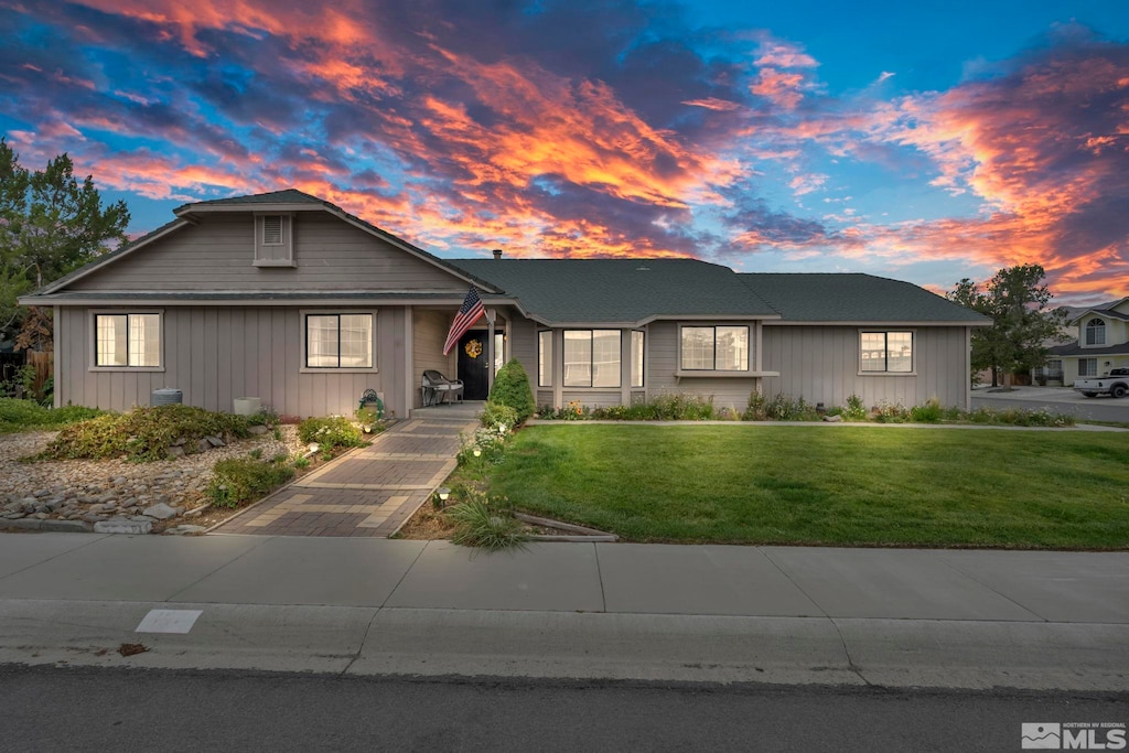 view of front of property with a yard