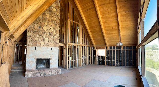 interior space with wood ceiling, lofted ceiling with beams, and a wealth of natural light