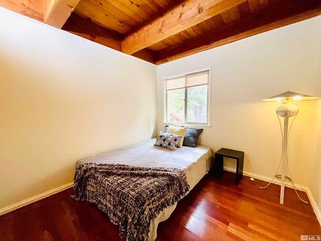 bedroom with beamed ceiling, wood ceiling, and hardwood / wood-style floors