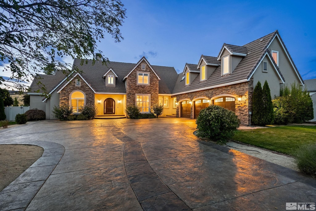 view of front of home featuring a yard and a garage