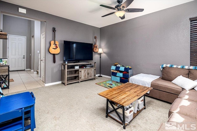 living room with ceiling fan and carpet flooring