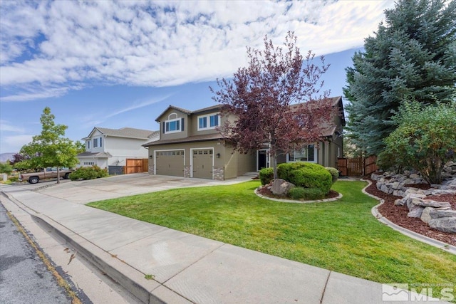 view of front of house with a garage and a front yard