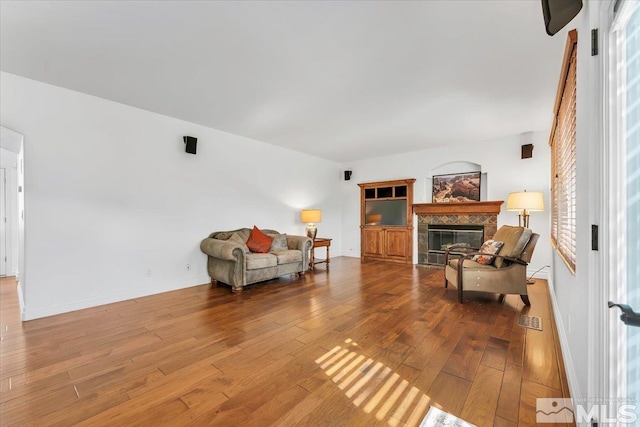 living area with hardwood / wood-style flooring