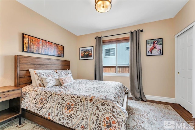 bedroom with hardwood / wood-style flooring