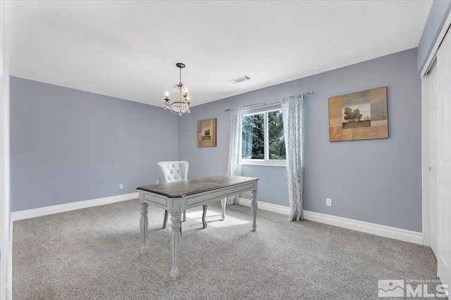 unfurnished office with carpet flooring and a chandelier