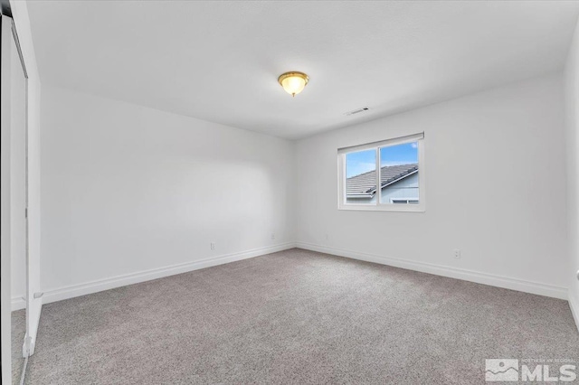 unfurnished room with carpet floors