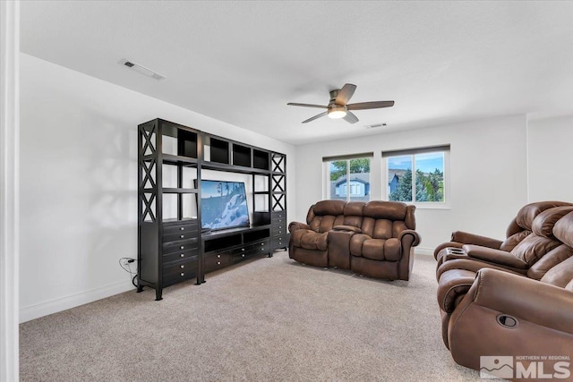 living room with carpet and ceiling fan