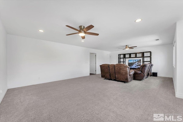 living room featuring ceiling fan and light colored carpet