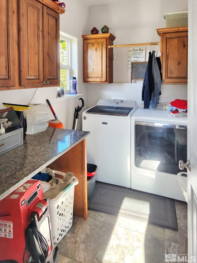 laundry room with cabinets and washing machine and dryer