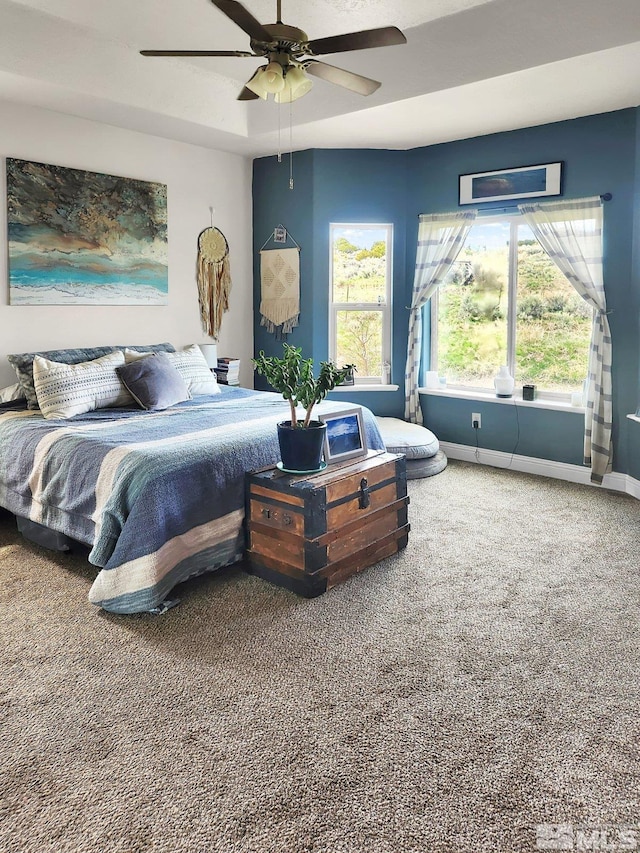 carpeted bedroom with ceiling fan