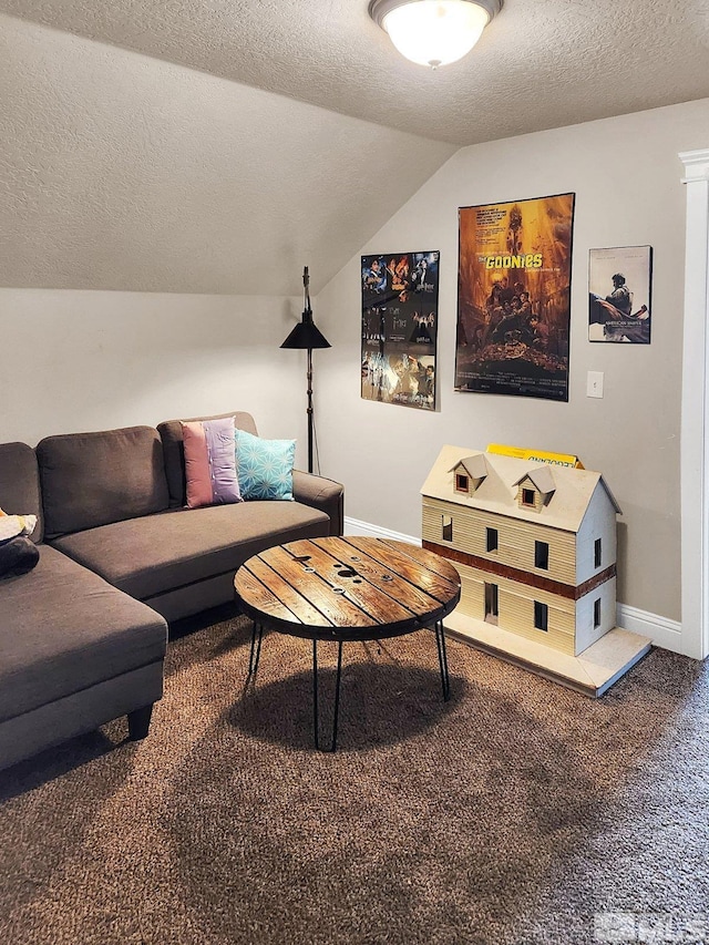 living room with lofted ceiling, a textured ceiling, and carpet floors