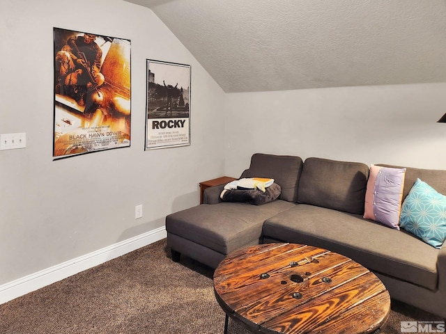 living room featuring a textured ceiling, lofted ceiling, and carpet