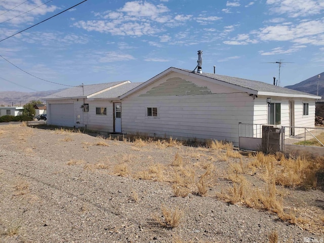 view of property exterior featuring a garage