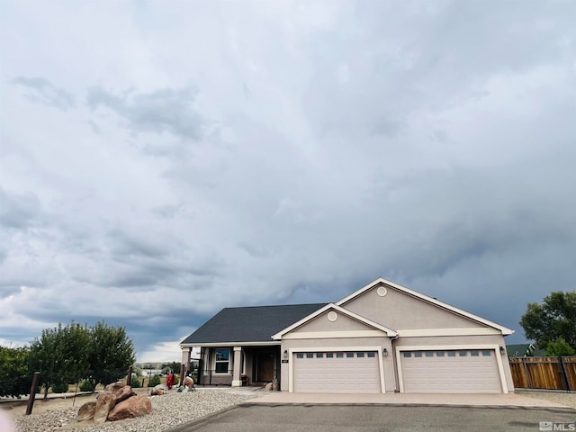 ranch-style home featuring a garage