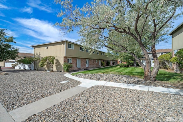 exterior space featuring a front lawn