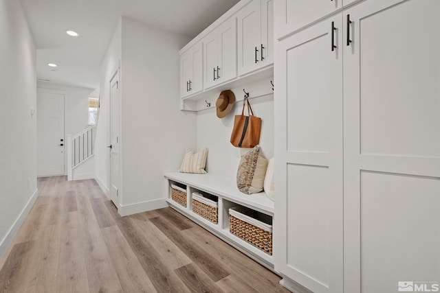 mudroom with light hardwood / wood-style flooring