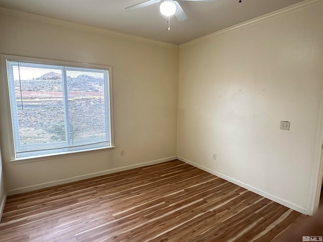 unfurnished room featuring ceiling fan, ornamental molding, and hardwood / wood-style flooring