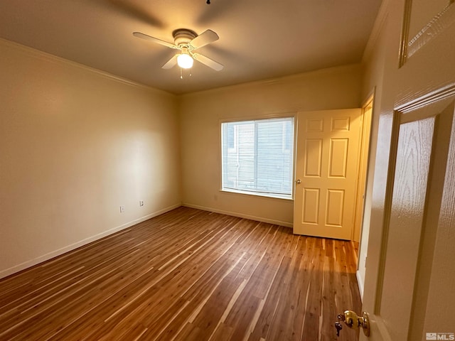 unfurnished bedroom with ceiling fan, crown molding, and hardwood / wood-style flooring