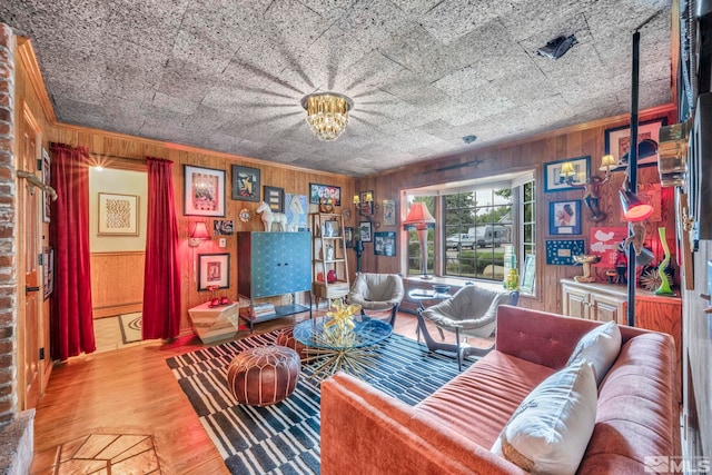 living room with light wood-type flooring and wood walls