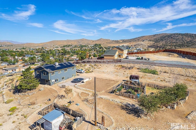 birds eye view of property featuring a mountain view