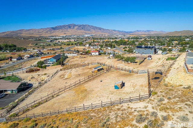 birds eye view of property with a mountain view