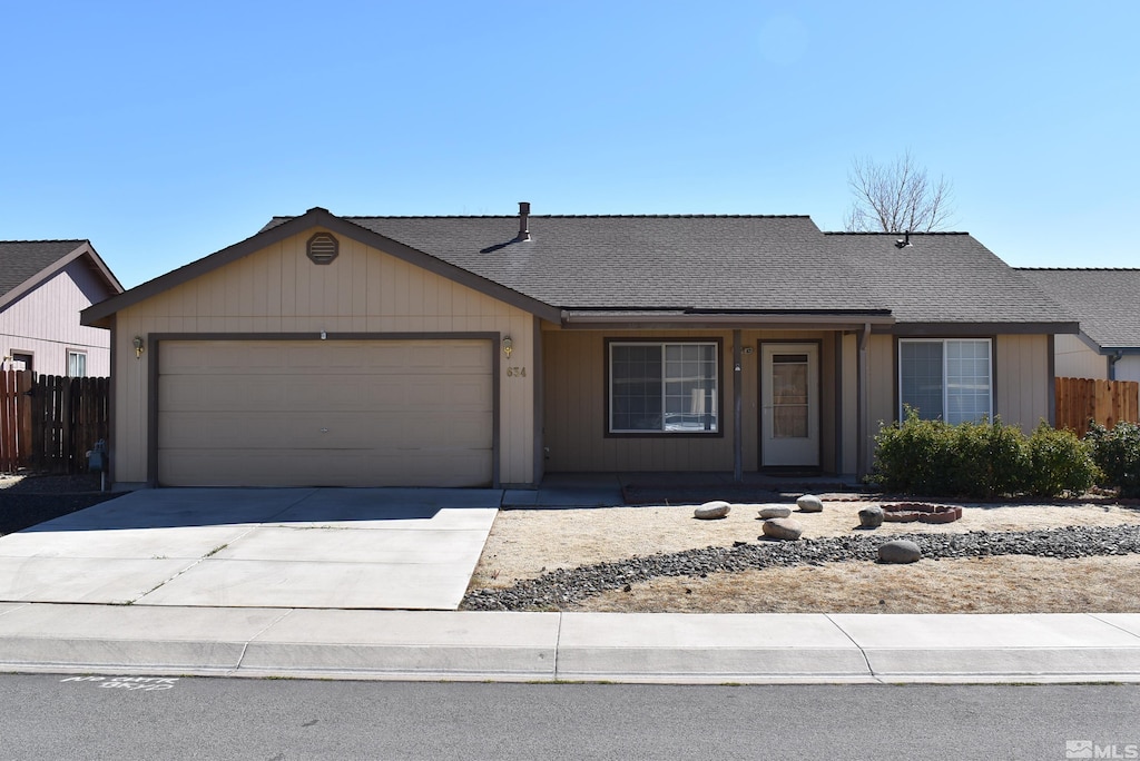 ranch-style home featuring a garage