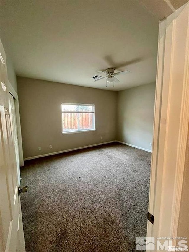 unfurnished room with carpet and ceiling fan