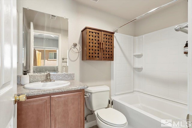 full bathroom featuring vanity, toilet, and tiled shower / bath combo