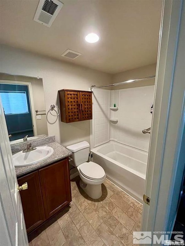 full bathroom featuring vanity, toilet, and washtub / shower combination