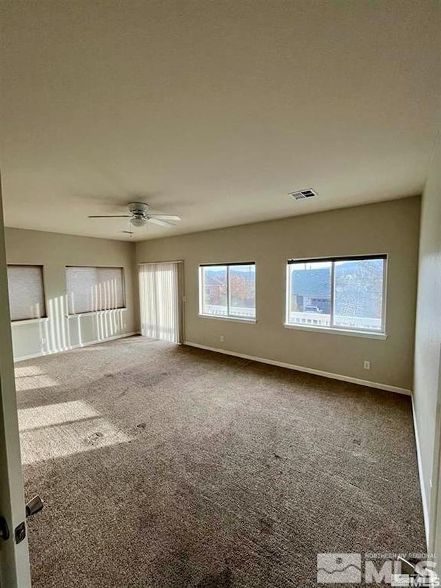 carpeted empty room with ceiling fan