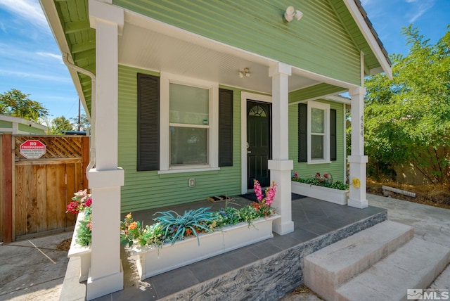 doorway to property with covered porch