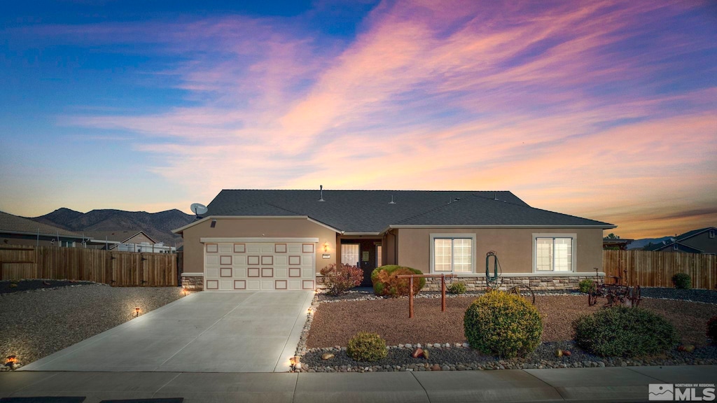 ranch-style house featuring a garage