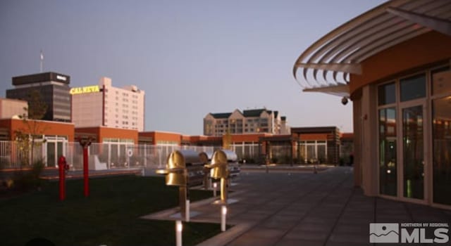 view of patio terrace at dusk