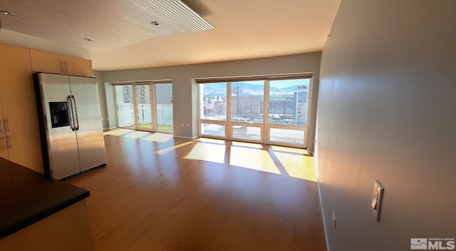 interior space with light hardwood / wood-style floors and plenty of natural light