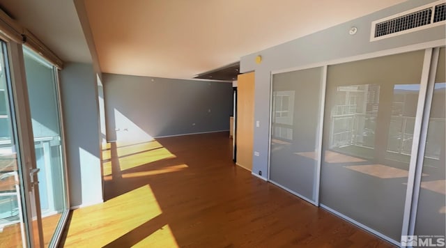 unfurnished room featuring hardwood / wood-style flooring