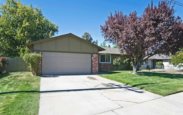 single story home featuring a garage and a front yard