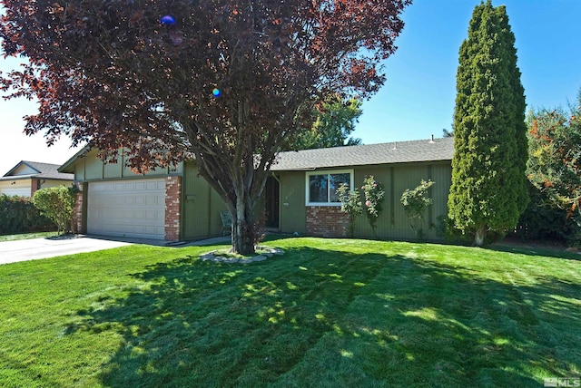 ranch-style home featuring a front yard and a garage