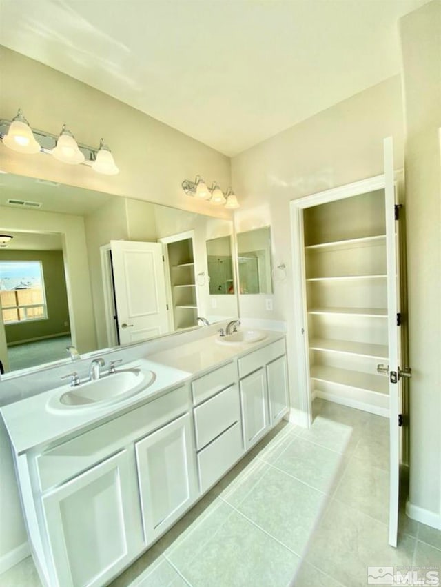 bathroom with vanity and tile patterned floors