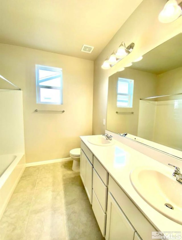 full bathroom with a wealth of natural light, shower / washtub combination, vanity, and toilet