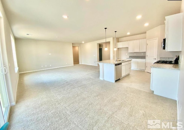 kitchen with a center island with sink, white cabinetry, pendant lighting, and stainless steel appliances